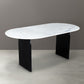 72" White and Black Marble And Solid Wood Sled Base Oval Dining Table