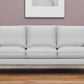 87" Gray Leather Sofa And Toss Pillows With Brown Legs