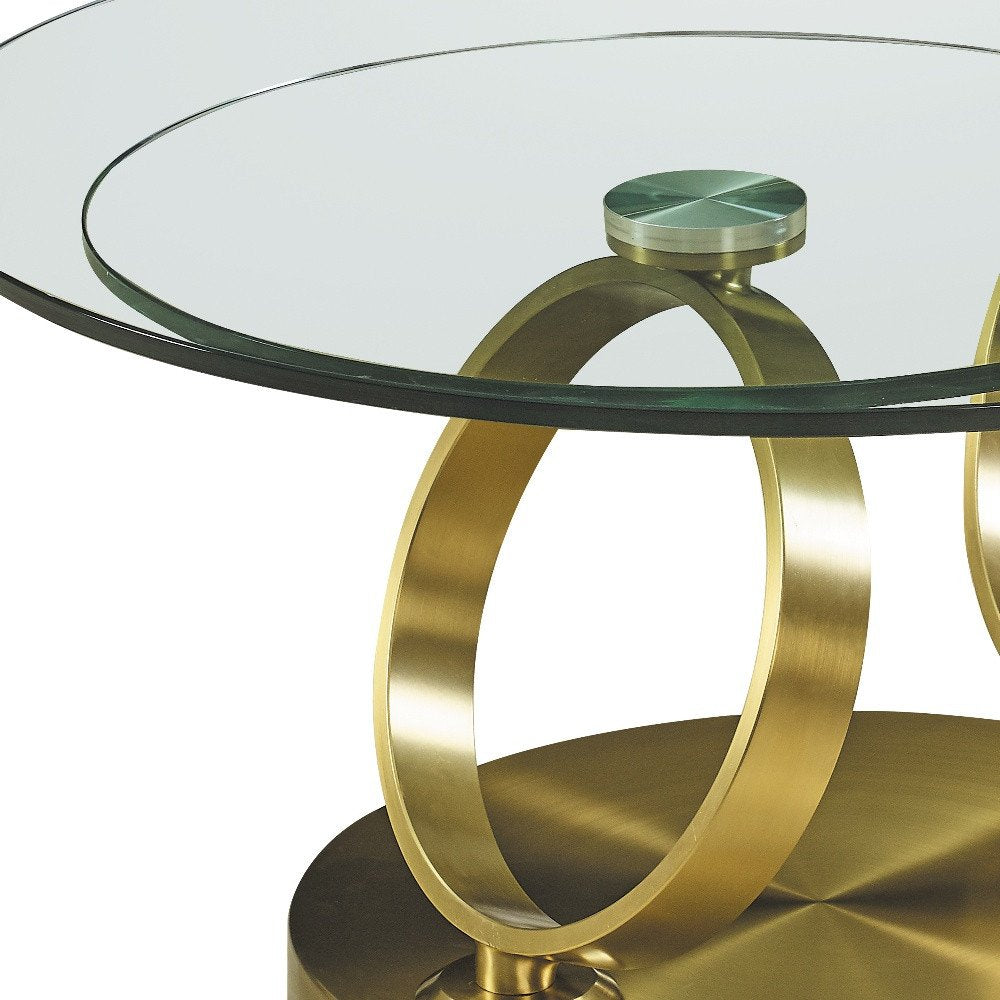 32" Clear And Gold Glass And Metal Round Abstract Coffee Table