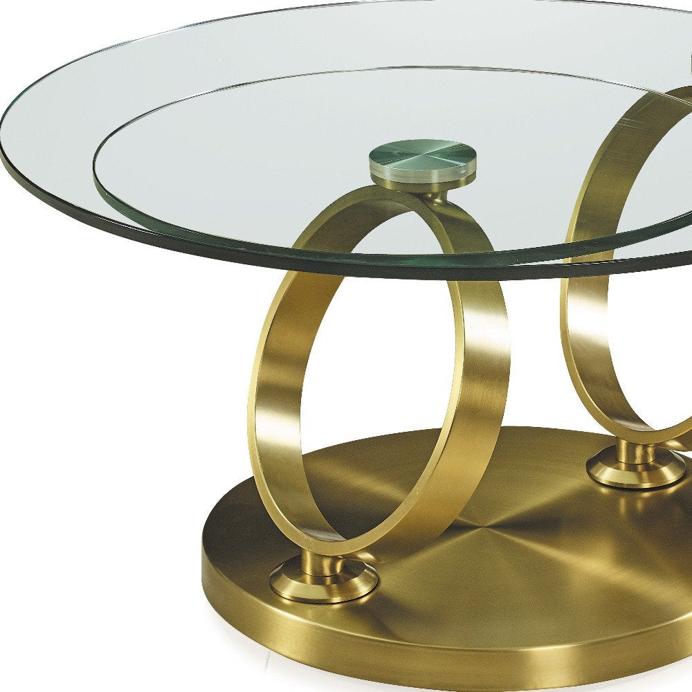 32" Clear And Gold Glass And Metal Round Abstract Coffee Table