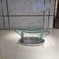 30" Clear And Silver Glass And Metal Oval Abstract Coffee Table