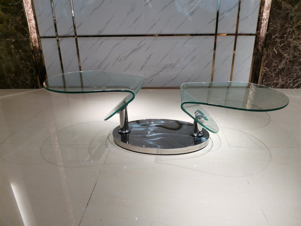 30" Clear And Silver Glass And Metal Oval Abstract Coffee Table