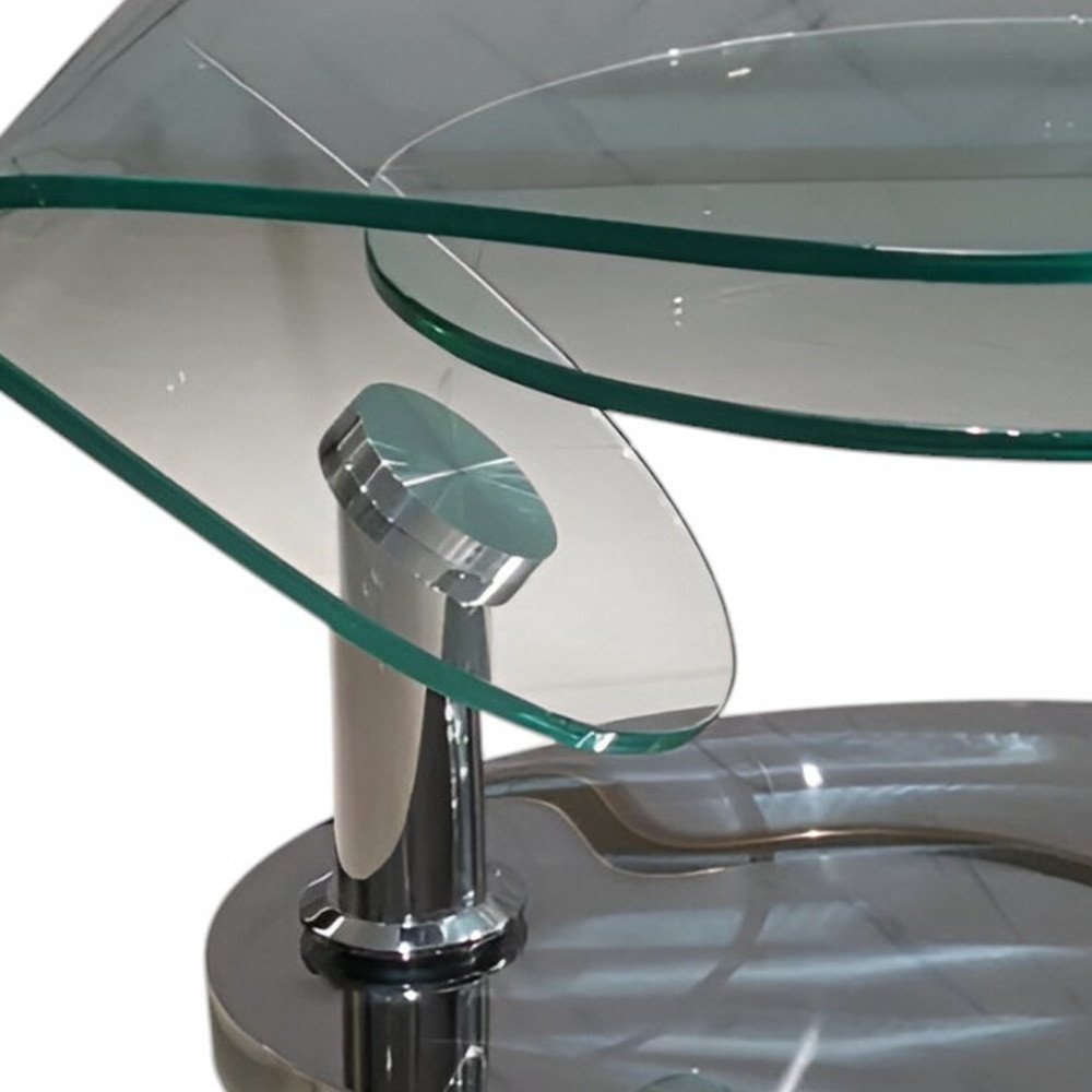 30" Clear And Silver Glass And Metal Oval Abstract Coffee Table