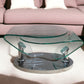 30" Clear And Silver Glass And Metal Oval Abstract Coffee Table