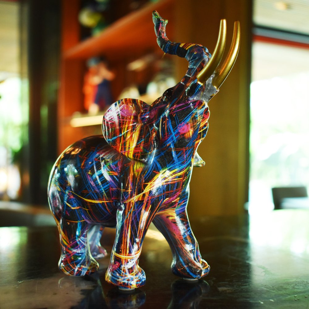 7" Blue Yellow And Pink Resin Elephant Tabletop Sculpture