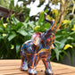 7" Blue Yellow And Pink Resin Elephant Tabletop Sculpture