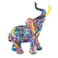 7" Blue Yellow And Pink Resin Elephant Tabletop Sculpture