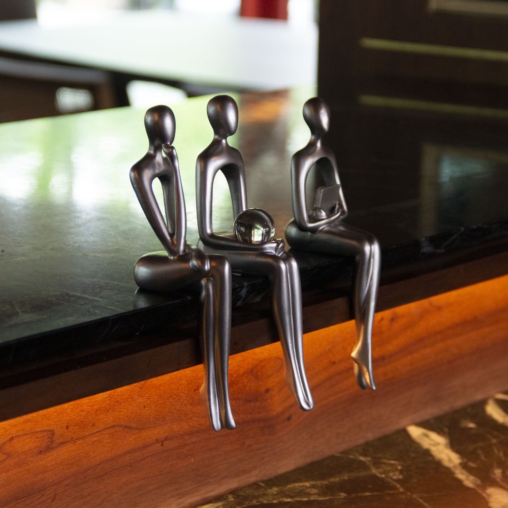 Set of Three Silver Resin People Tabletop Sculpture