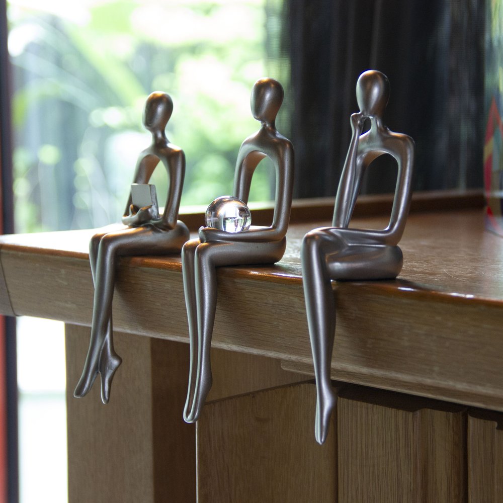 Set of Three Silver Resin People Tabletop Sculpture