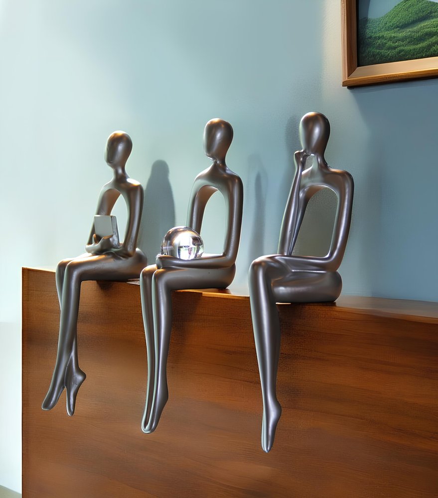 Set of Three Silver Resin People Tabletop Sculpture