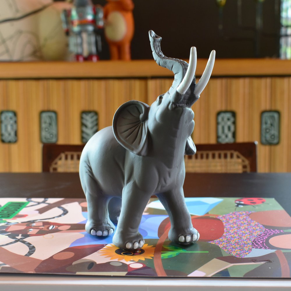 7" Stone And White Resin Elephant Tabletop Sculpture