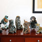Set of Eight Brown White And Black Resin Panda, Bird, Bear, Monkey, Penguin, Elephant, Tiger, Owl Tabletop Sculpture