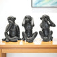 Set of Three Black Resin Monkey Tabletop Sculpture