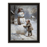 Boy Building A Snowman Black Framed Wall Art