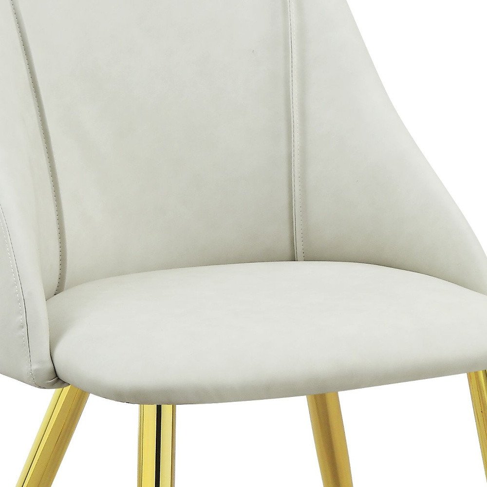 Set of Two White and Gold Upholstered Faux Leather And Metal Dining Side Chairs