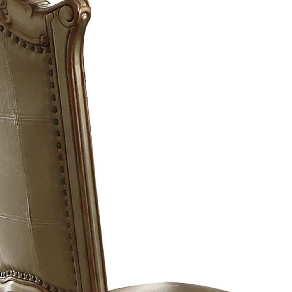 Set of Two Tufted Bone and Brass Upholstered Faux Leather And Wood Dining Side Chairs