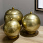Set of Three Gold Metal Decorative Lidded Canisters
