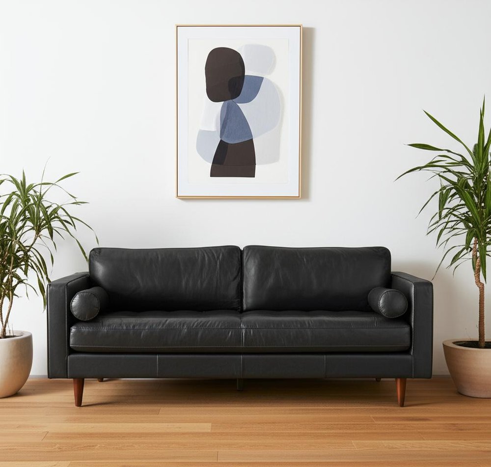 88" Black Leather Sofa And Toss Pillows With Brown Legs