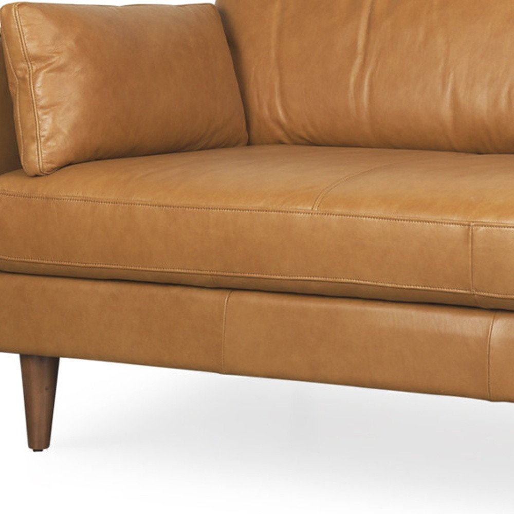 88" Tan Leather Sofa And Toss Pillows With Brown Legs