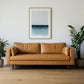 88" Tan Leather Sofa And Toss Pillows With Brown Legs