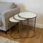 Set of Three White and Antiqued Gold Marble and Iron Round Frame Nested Tables
