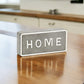 4" Gray And White Metal Home Hand Painted Tabletop Sign