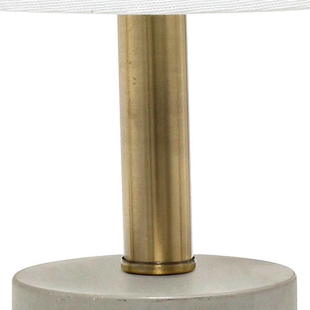 18" Gray And Antiqued Brass Concrete And Metal Table Lamp With White Drum Shade