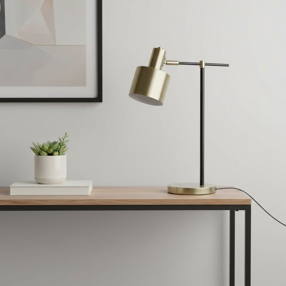 22" Antiqued Brass And Black Metal Table Lamp With Antiqued Brass Globe Shade