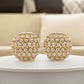 Set of Two Gold Ivory And Pearl Faux Crystal And Metal Decorative Orbs