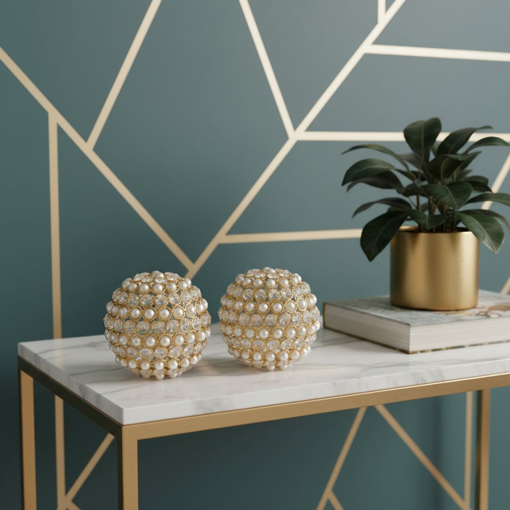 Set of Two Gold Ivory And Pearl Faux Crystal And Metal Decorative Orbs