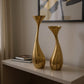 Set of Two Antiqued Gold Aluminum Wavy Faceted Tabletop Pillar Candle Holders