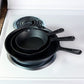 Set of Three Black Cast Iron Frying Pans