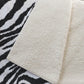 50" X 70" Black And Ivory Animal Print Polyester Woven Plush Throw Blanket