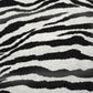 50" X 70" Black And Ivory Animal Print Polyester Woven Plush Throw Blanket