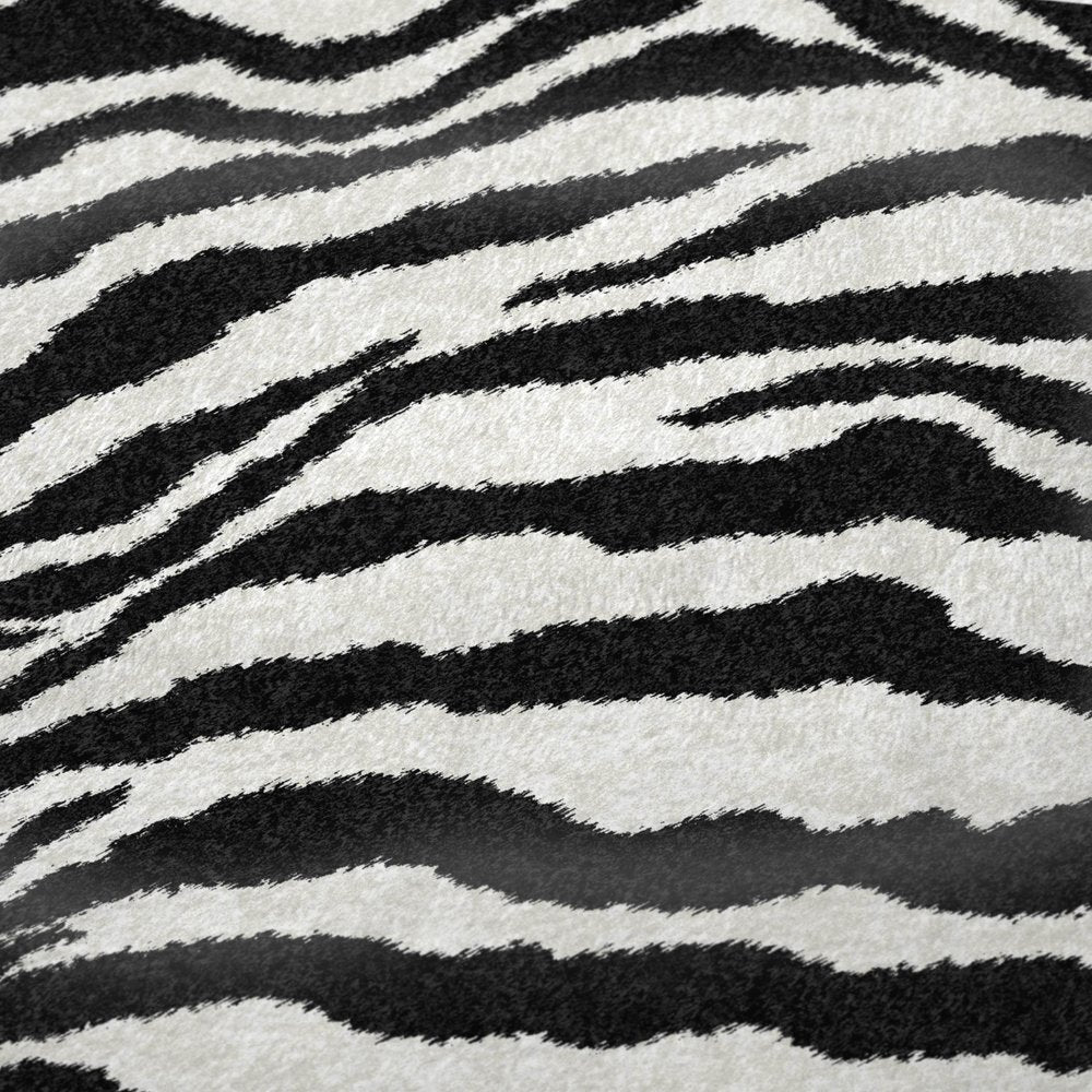 50" X 70" Black And Ivory Animal Print Polyester Woven Plush Throw Blanket