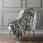 50" X 70" Black And Ivory Animal Print Polyester Woven Plush Throw Blanket