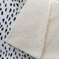 50" X 70" Pearl And Black Animal Print Polyester Woven Plush Throw Blanket