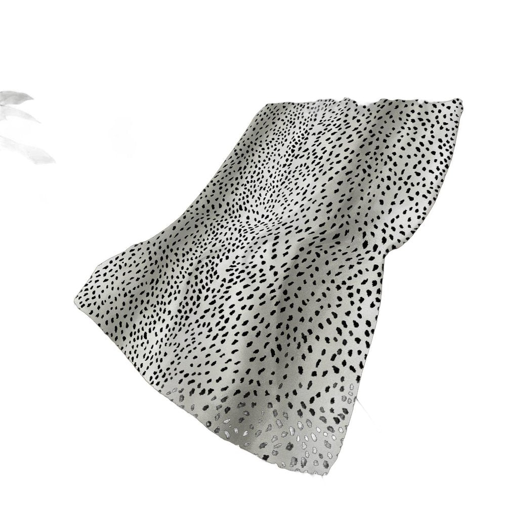 50" X 70" Pearl And Black Animal Print Polyester Woven Plush Throw Blanket