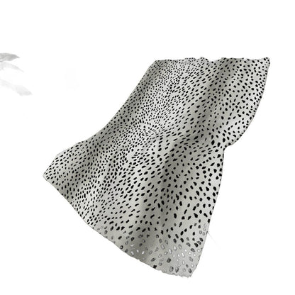 50" X 70" Pearl And Black Animal Print Polyester Woven Plush Throw Blanket