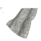 50" X 70" Pearl And Black Animal Print Polyester Woven Plush Throw Blanket