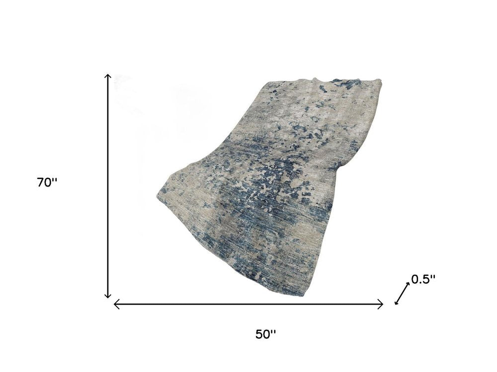 50" X 70" Blue Beige And Ivory Abstract Polyester Woven Plush Throw Blanket