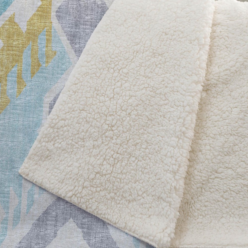 50" X 70" Aqua Gold And Ivory Microfiber Ikat Plush Throw Blanket