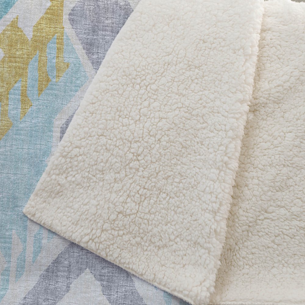 50" X 70" Aqua Gold And Ivory Ikat Polyester Woven Plush Throw Blanket