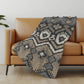 50" X 70" Sand Ivory And Gray Ikat Polyester Woven Plush Throw Blanket