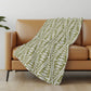 50" X 70" Olive Green And Beige Geometric Polyester Woven Plush Throw Blanket