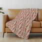 50" X 70" Rust And Beige Geometric Polyester Woven Plush Throw Blanket