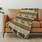 50" X 70" Brown Green And Rust Animal Print Polyester Woven Plush Throw Blanket