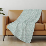 50" X 70" Green And Ivory Animal Print Polyester Woven Plush Throw Blanket